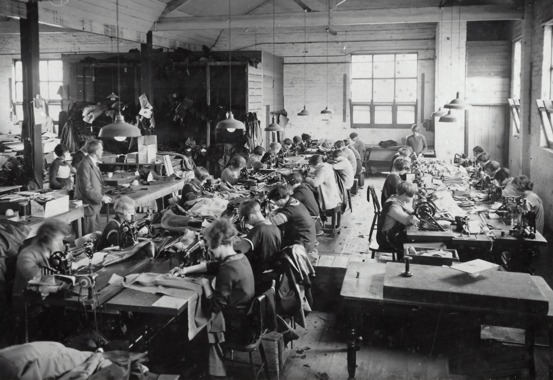 A group of people working in an old factory.