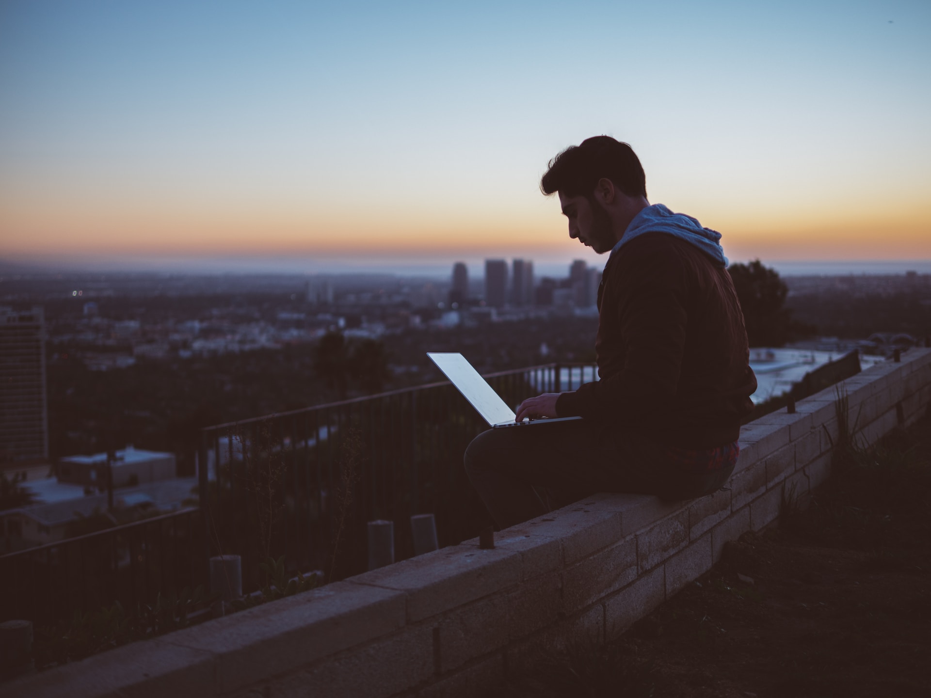 A person using a laptop out of the office.